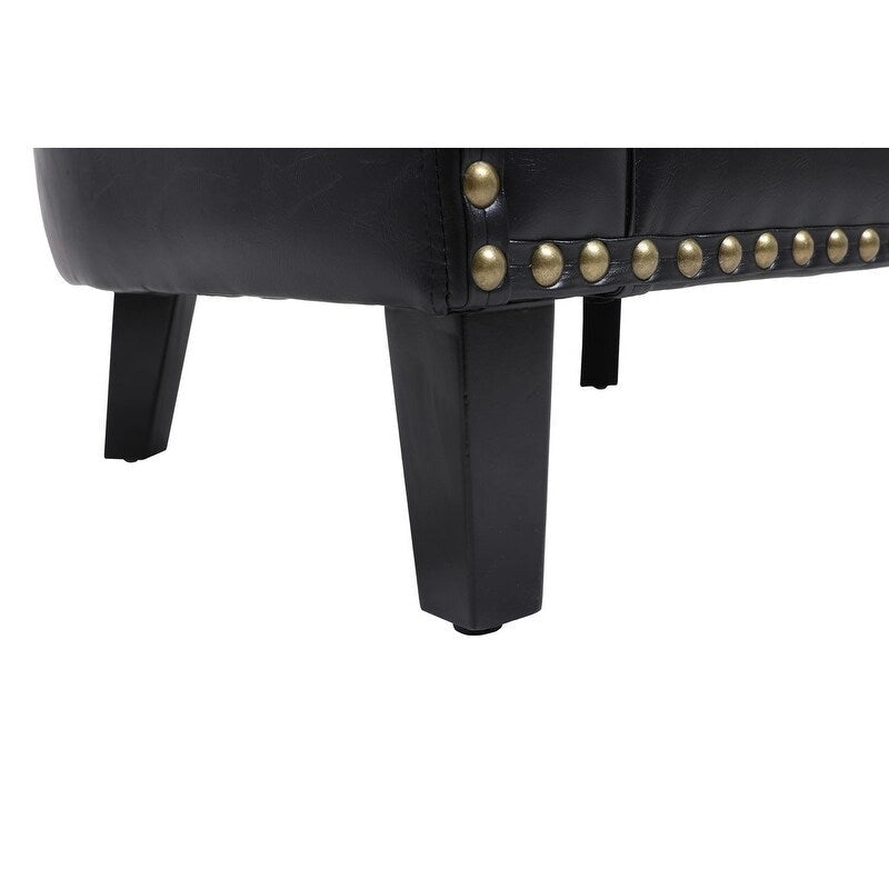 Poltrona a botte con borchie e gambe in legno massello - Ecopelle Nera