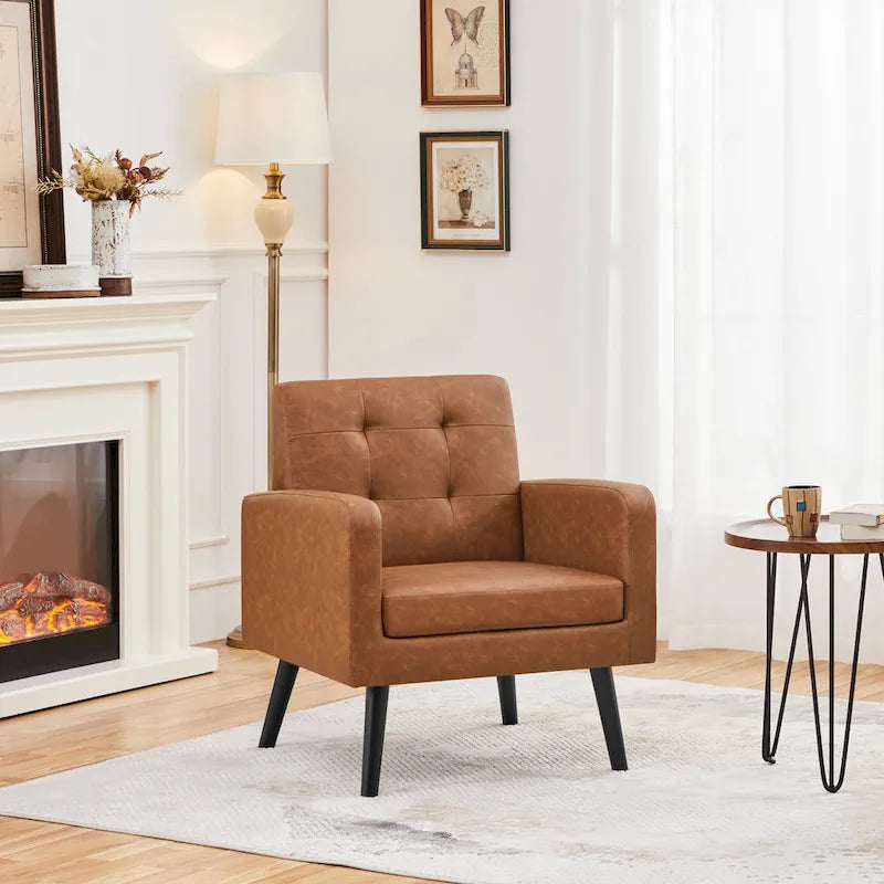 Poltrona moderna accentata con imbottitura capitonné in similpelle e gambe in legno massello